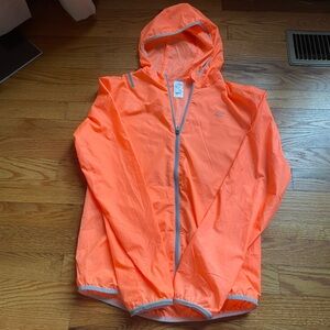 neon orange athletic light jacket from decathlon  size 14 years